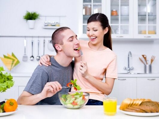 a woman feeds a man products to naturally increase potency